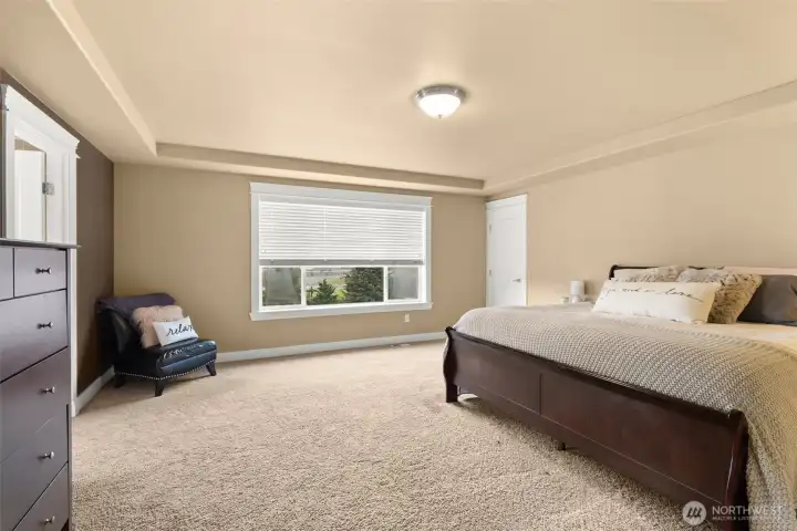 Private primary retreat overlooking the landscaped yard.