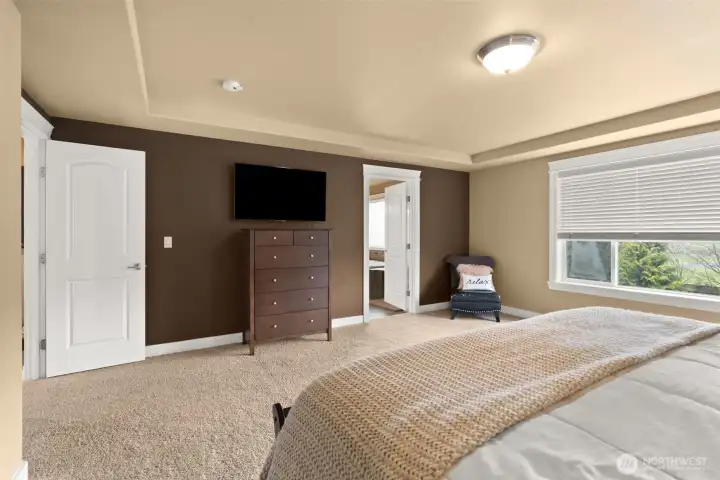 Primary bedroom with plenty of space to have a seating area.