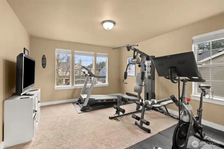 Large bedroom overlooking the front of the home with ample natural light.