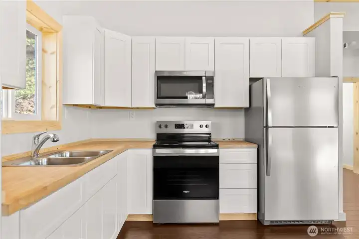 Stainless steel appliances in this new home- clean, bright and ready for you!