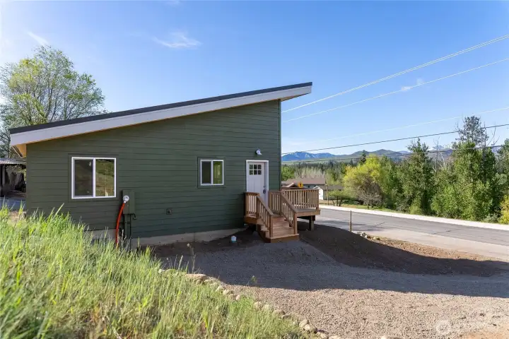 Driveway and entryway.  Room available for a carport or shed.
