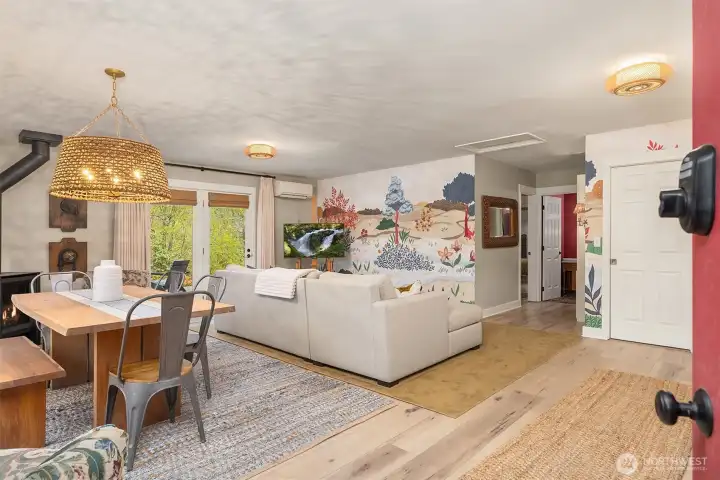 Enter to an open-concept on the main floor with high ceilings, beautiful maple floors and a cozy propane stove