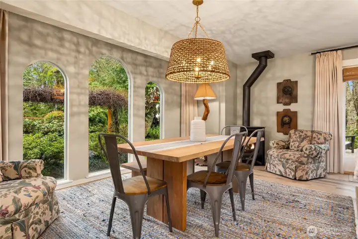 Enjoy garden views from the dining area, framed by elegant arched windows
