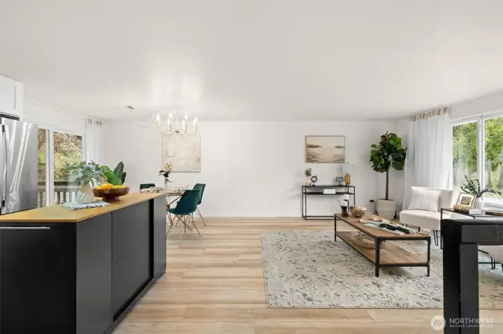 Upstairs open concept; living room, kitchen and dining