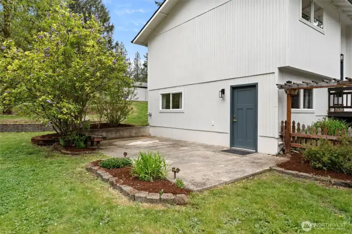 Side door entrance to downstairs, off large patio