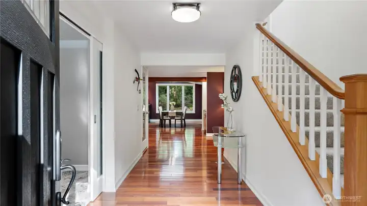 Inside, you're welcomed by Brazilian cherry floors that positively glow, bringing richness, warmth, and an unmistakable sense of quality to the space. It’s a beautiful introduction to the level of care and craftsmanship found throughout the home.