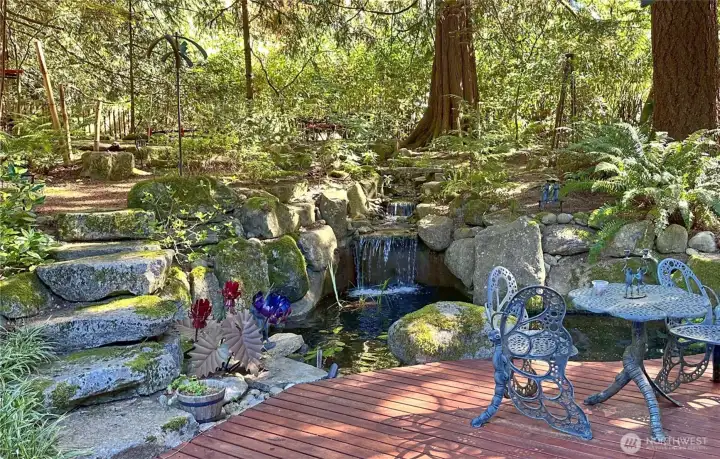 This is one of those spaces that makes you want to stay a little longer. The waterfall tumbles into a pond with three large koi, while a second pond rests above. It’s a wonderfully layered design that brings movement, sound, and such a calming presence to the garden. This is one of those spaces that makes you want to stay a little longer. The waterfall tumbles into a pond with three large koi, while a second pond rests above. It’s a wonderfully layered design that brings movement, sound, and such a calming presence to the garden.