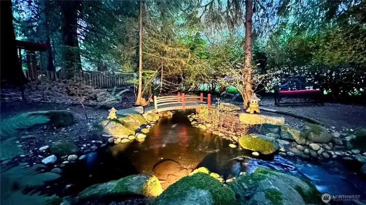 The upper pond is graced by an arch bridge, pagodas, and another sitting area, adding yet another layer of charm to the garden experience. It’s a lovely little destination within the landscape, inviting you to pause and take it all in.