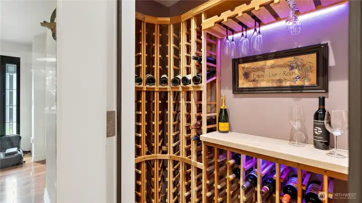 Back inside, the features continue with this insulated wine cellar, softly illuminated by LED lighting. There’s even a smurf tube already in place for a future condenser, allowing for more precise temperature control down the road. Back inside, the features continue with this insulated wine cellar, softly illuminated by LED lighting. There’s even a smurf tube already in place for a future condenser, allowing for more precise temperature control down the road.