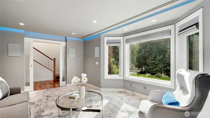 Audiophiles, rejoice... this media room is in a class of its own. With two dedicated 20-amp circuits, built-in Focal 1000-series speakers, QuietRock drywall, commercial-grade LED color-changing lighting, soft-close ripple glass doors and blackout blinds,  it delivers a truly exceptional listening and viewing experience.