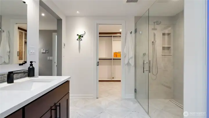 The walk-in closet is such a delight, thoughtfully outfitted with a California Closet system and special built-in features that make staying organized so much easier. It’s one of those details you’ll appreciate every single day.