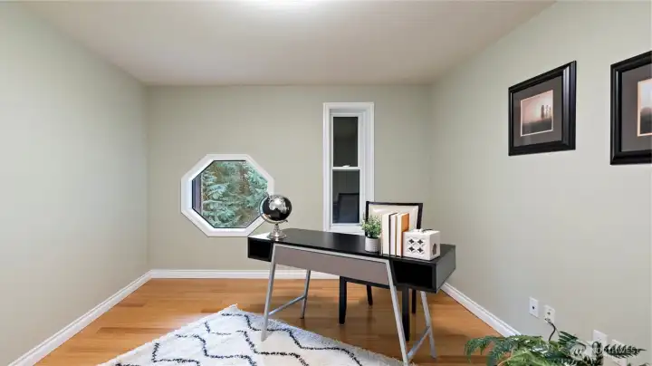 Perfectly sized for working from home, this upstairs office is full of warmth, with gorgeous wood floors and an octagon window that gives the space its own distinct personality. It’s easy to picture settling in here for a productive day, with a setting that brings a little more character and calm to the everyday routine. Perfectly sized for working from home, this upstairs office is full of warmth, with gorgeous wood floors and an octagon window that gives the space its own distinct personality. It’s easy to picture settling in here for a productive day, with a setting that brings a little more character and calm to the everyday routine.