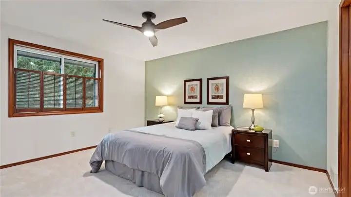 A spacious guest bedroom offers comfort, flexibility, and plenty of room to settle in with ease.
