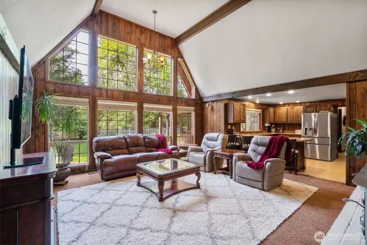 As you walk into the family room you are met by vaulted ceilings, a cozy wood burning stove with insert and amazing windows that look out into the fully fenced back yard.  Perfect for BBQ's, kids or pets.
