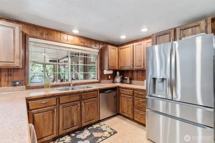 The kitchen is right off the family room.  Newer stainless fridge.  All appliances stay.