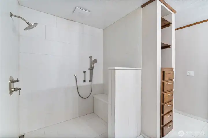 Stunning walk-in, tiled shower.  Built in's for all your bathroom stuff.