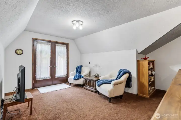 Fun reading space upstairs with a private deck.
