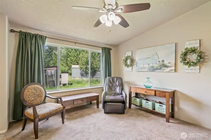 DADU living room overlooks the fenced yard and the chicken friends.  Farm fresh eggs await.