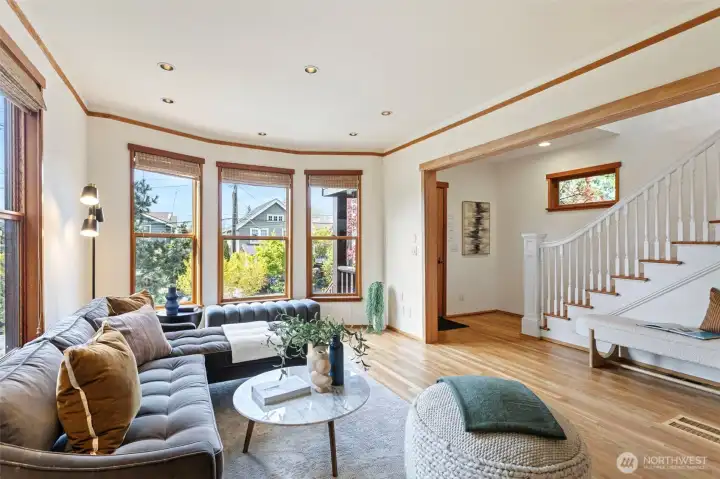 Front entry on 10th Ave W opens to informal living room (main level)