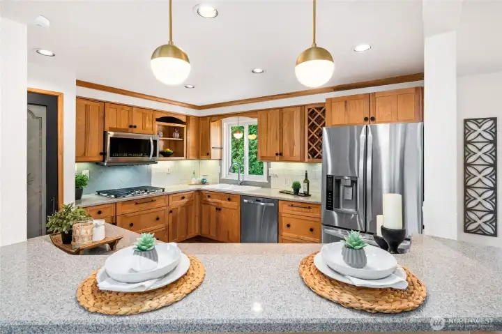 Quartz countertops and new kitchen pendant light fixtures.