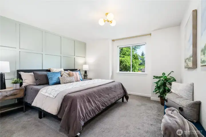 Primary suite down the hall with custom detail wall.