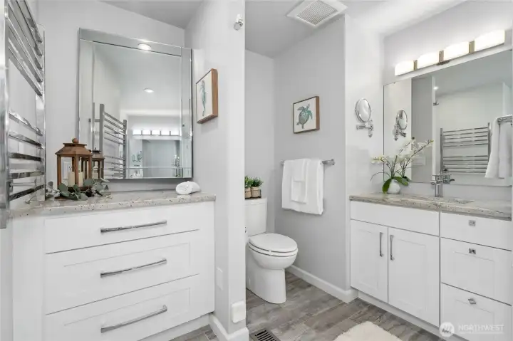 Movable mirror station and towel warming rack are some thoughtful features here.