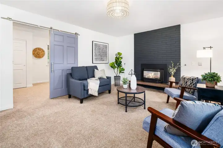 Lower level family room. Barn door leads to lower bedroom.