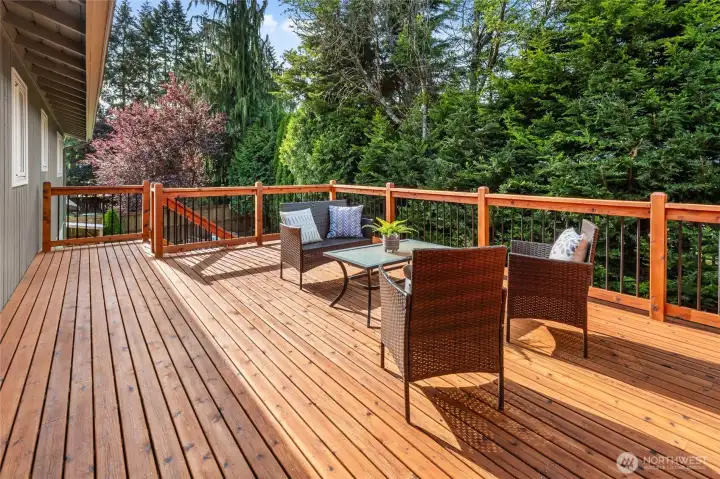 Extra large and beautifully finished main level back deck.