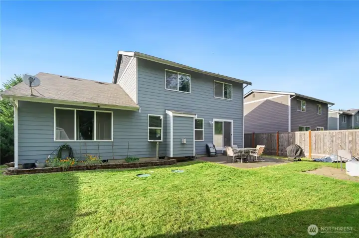Large backyard with storage shed and firepit Large backyard with storage shed and firepit