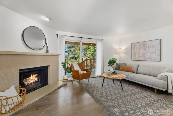 Spacious and bright living room opening up to a large balcony and backyard.
