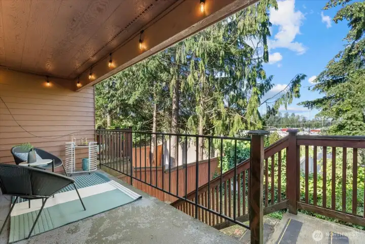 Main floor balcony, with stairs going down to fully fenced private yard.