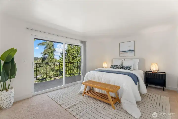 Primary bedroom with private balcony.