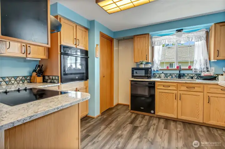 Kitchen with granite counter tops and ample cabinet space