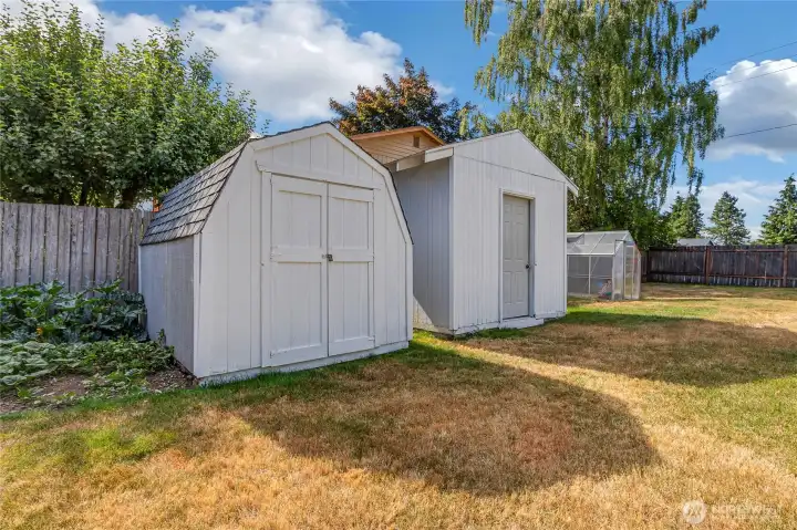 Storage sheds in fully fenced back yard
