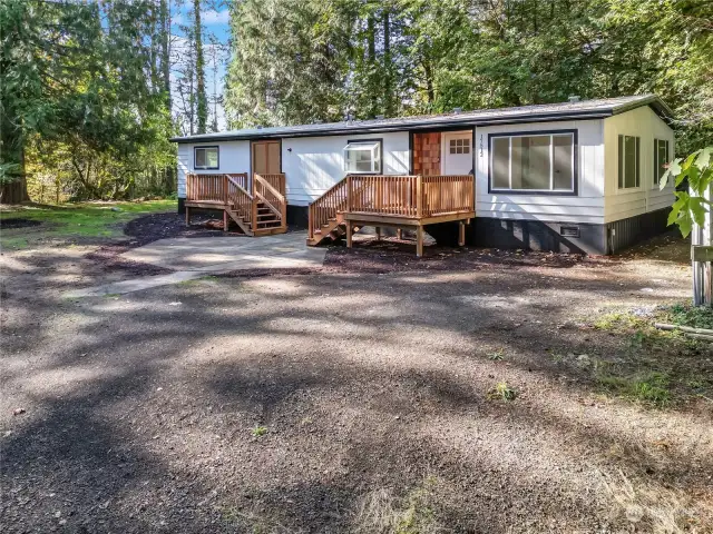 Must see newly updated manufactured home on 1 acre surrounded by nature ready to move in or keep as rental invesment property minutes to Puget sound beaches and water fun