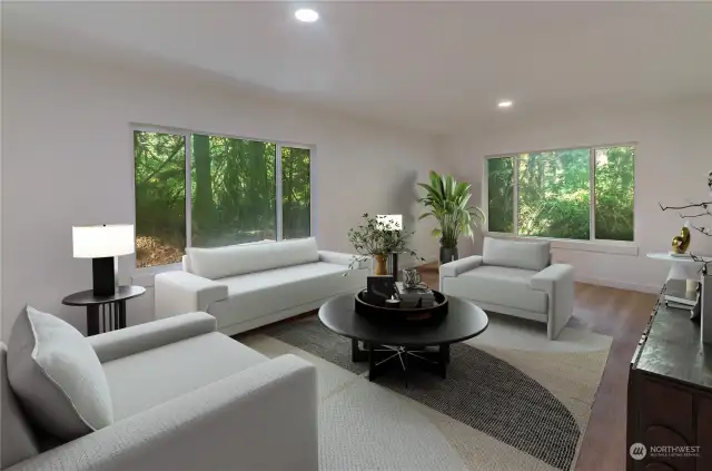 Virtually staged inside view of great room off kitchen with new paint windows and lighting.  See outside to nature and wildlife year around