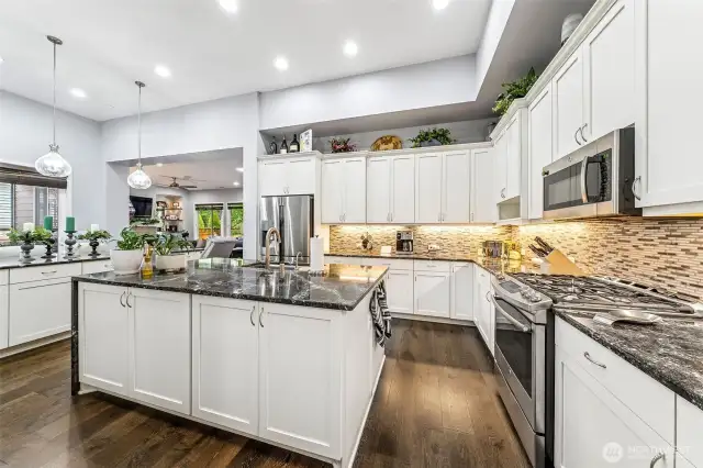 Full tile backsplash, gas range, tons of cabinets, what more could you want?