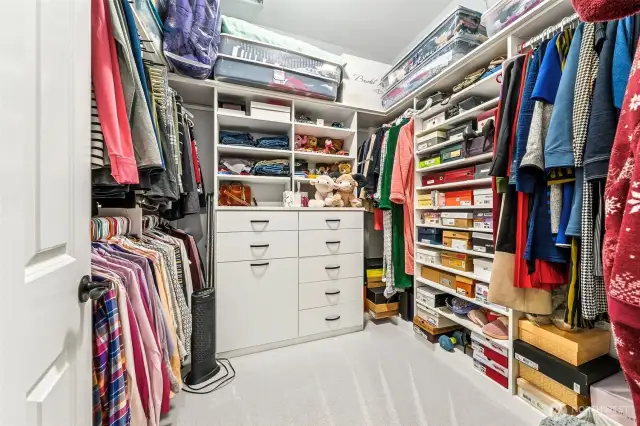 One of 2 closets with California closet system in Primary
