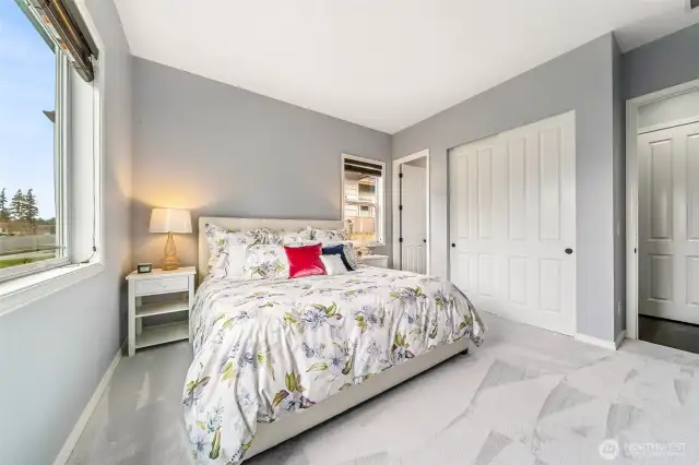 Another view of the front bedroom with attached bathroom in background