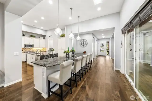 Reverse view of entry with kitchen in view.