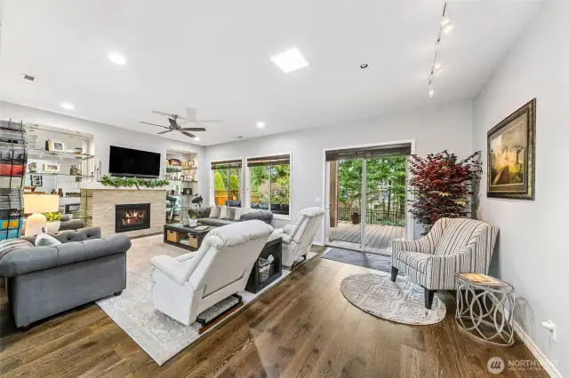 Great room with slider out to back deck and lovely forest view