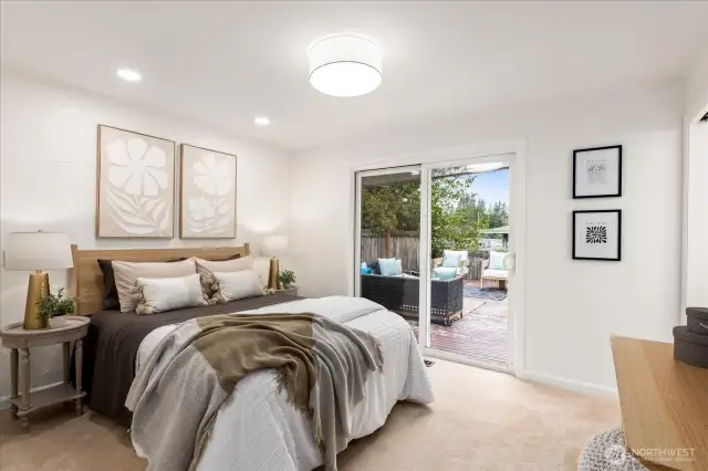 Spacious primary bedroom with updated en-suite bath