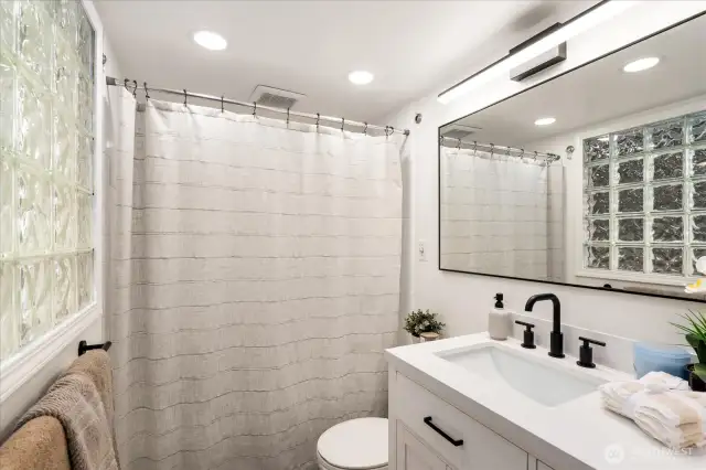 Primary bathroom shines with fresh, modern updates