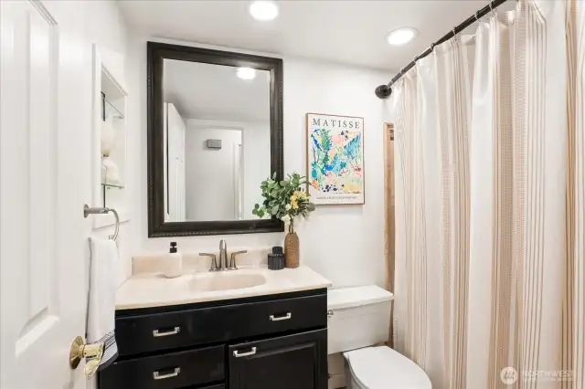 Well-appointed shared bath with a full-size tub
