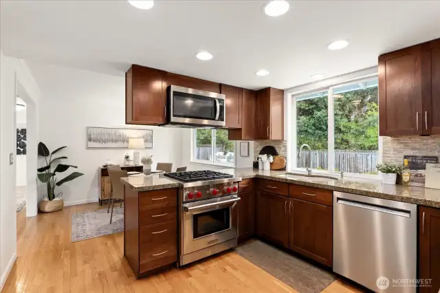 Chef-inspired kitchen featuring high-end appliances and a WOLF range