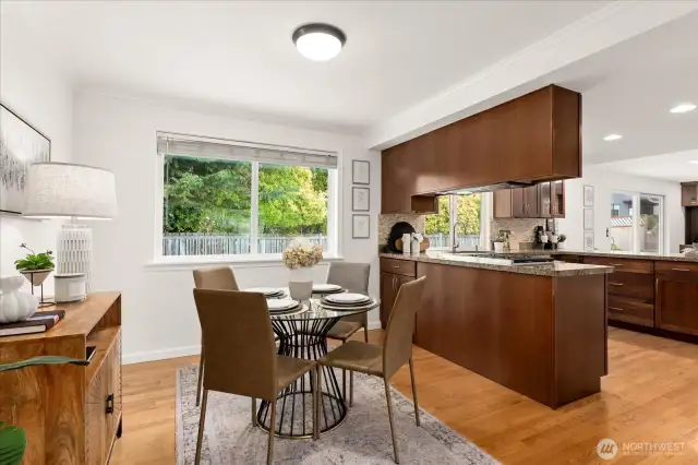An inviting dining space, naturally lit through a lovely window