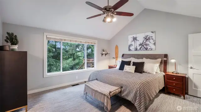 Enjoy tranquil backyard views in this spacious and relaxing primary suite