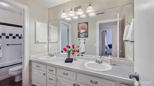 Convenient full bath with dual sinks and private bathing area adjacent to all 3 secondary bedrooms.