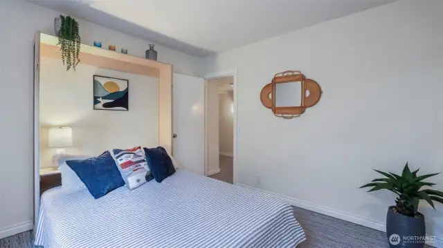 Convenient Murphy Bed provides multiple uses for this room