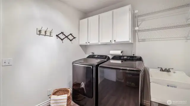 Laundry room with storage and convenient utility sink